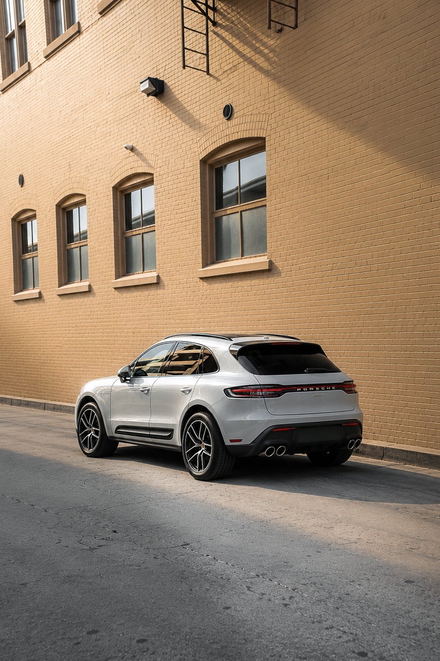 Porsche Macan S rear three quarter view in an urban alley