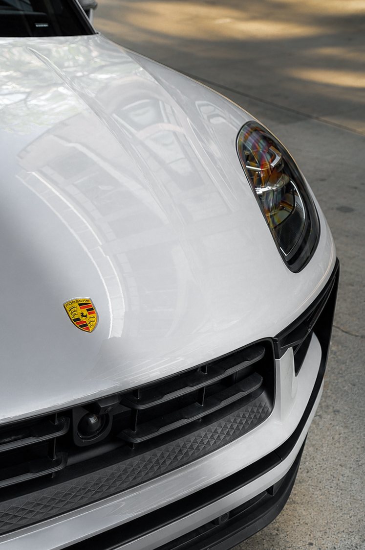 Porsche Macan S hood and headlight detail with reflections